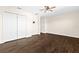 Bedroom with wood floors and double doors at 7860 Atwood Dr, Wesley Chapel, FL 33545