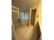 Bathroom with corner tub, shower, and tile flooring at 8216 Carriage Pointe Dr, Gibsonton, FL 33534