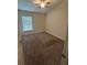 Carpeted bedroom with ceiling fan and window with blinds at 8216 Carriage Pointe Dr, Gibsonton, FL 33534