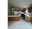 Bright kitchen with ample counter space and cabinets at 8216 Carriage Pointe Dr, Gibsonton, FL 33534