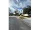 Residential street with houses and parked cars at 8216 Carriage Pointe Dr, Gibsonton, FL 33534