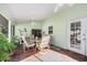 Relaxing screened porch with patio furniture at 12304 N Oregon Ave, Tampa, FL 33612