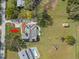 Aerial view of property with a long driveway, swimming pool, shed, and ample outdoor space at 13213 106Th Ave, Largo, FL 33774