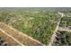 Aerial view of a wooded lot near a road at 15577 Little Ranch Rd, Spring Hill, FL 34610