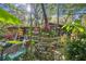 Rustic yard with plants, shed, and fence at 15577 Little Ranch Rd, Spring Hill, FL 34610