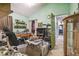 A cluttered bedroom with access to another room at 15577 Little Ranch Rd, Spring Hill, FL 34610