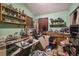 A cluttered bedroom with a dresser and various items at 15577 Little Ranch Rd, Spring Hill, FL 34610