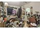 A cluttered bedroom with a ceiling fan and a bed at 15577 Little Ranch Rd, Spring Hill, FL 34610