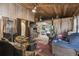 Open concept living room and kitchen with wood ceiling and flooring at 15577 Little Ranch Rd, Spring Hill, FL 34610