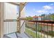 Private balcony overlooking landscaped grounds and neighboring buildings at 18106 Peregrines Perch Pl # 5204, Lutz, FL 33558