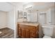 Bathroom with wood vanity and granite countertop at 18106 Peregrines Perch Pl # 5204, Lutz, FL 33558
