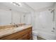 Bathroom features granite countertop, tub and shower at 18106 Peregrines Perch Pl # 5204, Lutz, FL 33558