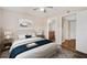 Bedroom with ceiling fan and ensuite bathroom at 18106 Peregrines Perch Pl # 5204, Lutz, FL 33558