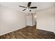 Well-lit bedroom with ceiling fan and hardwood floors at 18106 Peregrines Perch Pl # 5204, Lutz, FL 33558