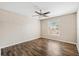 Bright bedroom with large window and ceiling fan at 18106 Peregrines Perch Pl # 5204, Lutz, FL 33558