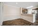 Spacious dining area with wood-look flooring and breakfast bar at 18106 Peregrines Perch Pl # 5204, Lutz, FL 33558