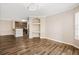 Spacious living room with hardwood floors and built-in shelving at 18106 Peregrines Perch Pl # 5204, Lutz, FL 33558