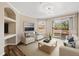 Living room with balcony access, stylish furniture, and recessed shelves at 18106 Peregrines Perch Pl # 5204, Lutz, FL 33558