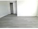 Simple bedroom with grey flooring and closet at 212 Francis Dr, Apollo Beach, FL 33572