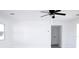 Bright bedroom with ceiling fan and door to hallway at 212 Francis Dr, Apollo Beach, FL 33572