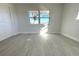 Spacious bedroom with large window and grey flooring at 212 Francis Dr, Apollo Beach, FL 33572