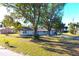 Ranch-style home with mature landscaping and large yard at 212 Francis Dr, Apollo Beach, FL 33572