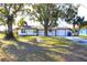 Front view of house with a yard and driveway at 212 Francis Dr, Apollo Beach, FL 33572