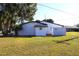 Rear view of house with a privacy wall at 212 Francis Dr, Apollo Beach, FL 33572