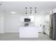 Bright kitchen with white cabinets, stainless steel appliances, and an island at 212 Francis Dr, Apollo Beach, FL 33572