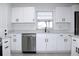 Updated kitchen featuring white shaker cabinets and stainless steel appliances at 212 Francis Dr, Apollo Beach, FL 33572