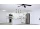 Modern kitchen with white cabinets, stainless steel appliances, and an island at 212 Francis Dr, Apollo Beach, FL 33572