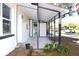 Screened side porch with concrete flooring and partial enclosure at 212 Francis Dr, Apollo Beach, FL 33572