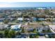 Aerial view showcasing home's waterfront proximity and neighborhood at 2463 Baywood E Dr, Dunedin, FL 34698