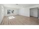 Open concept living room with hardwood floors and white walls at 2903 N Albany Ave, Tampa, FL 33607