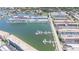 Aerial view of the coastal building complex with its marina, showcasing the waterfront property and its scenic surroundings at 2960 59Th S St # 411, Gulfport, FL 33707