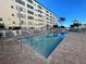 Inviting community pool with plenty of lounge chairs at 2960 59Th S St # 411, Gulfport, FL 33707