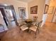 Small dining area with glass table and four chairs, near kitchen at 2960 59Th S St # 411, Gulfport, FL 33707