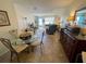 Dining area with a view into the kitchen and living room at 2960 59Th S St # 411, Gulfport, FL 33707