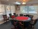 A cozy poker room with a round table and comfortable chairs, ideal for card games at 2960 59Th S St # 411, Gulfport, FL 33707