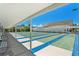 Enjoy the community shuffleboard courts with shaded seating and clear blue skies at 2960 59Th S St # 411, Gulfport, FL 33707
