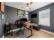 Home office with standing desk and built-in shelving at 3106 W Hartnett Ave, Tampa, FL 33611