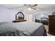 Bedroom with a queen bed, dark wood dresser and mirrored closet doors at 3136 Fairmount Dr, Holiday, FL 34691