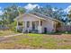 Charming bungalow exterior with blue door and porch at 3508 N Dartmouth Ave, Tampa, FL 33603