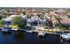 Aerial view of the house, pool, and backyard with canal access at 3812 Carupano Ct, Punta Gorda, FL 33950