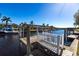 Private boat lift with wooden dock at 3812 Carupano Ct, Punta Gorda, FL 33950