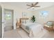 Bedroom featuring neutral walls, ceiling fan, and natural light from window at 4145 Harrisburg Ne St, St Petersburg, FL 33703