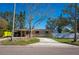 Single-story home with a long driveway and RV parking at 4145 Harrisburg Ne St, St Petersburg, FL 33703