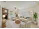 Cozy living room featuring a brick fireplace, ceiling fan, and carpeted flooring at 4145 Harrisburg Ne St, St Petersburg, FL 33703