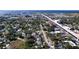 Aerial view showcasing house and surrounding neighborhood near waterfront at 4510 W Mcelroy Ave, Tampa, FL 33611