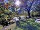 Serene backyard oasis with pond, dock, and lush landscaping at 4510 W Mcelroy Ave, Tampa, FL 33611
